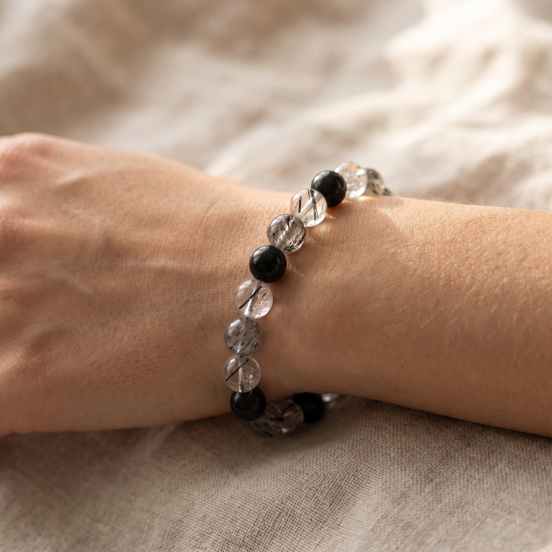 Black Tourmalinated Quartz Bracelet worn on wrist in natural light